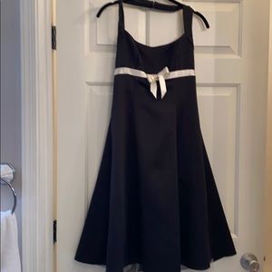Zum Zum black dress with white bow.